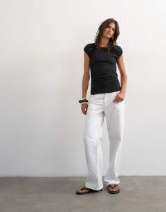 Model wearing Ruched back cut out top in black