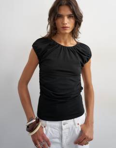 Model wearing Ruched back cut out top in black