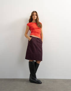 Model wearing Ruched back cut out top in red