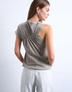 Model wearing Ruched back one sleeve top in taupe