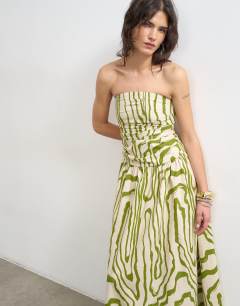 Model wearing Ruched bandeau midi dress in stripe