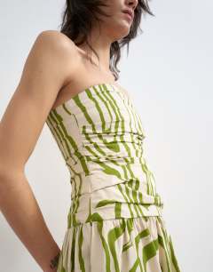 Model wearing Ruched bandeau midi dress in stripe