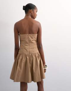 Model wearing Ruched bandeau mini dress in taupe