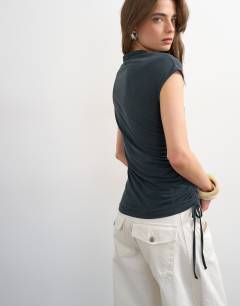 Model wearing Ruched detail cupro top in washed black