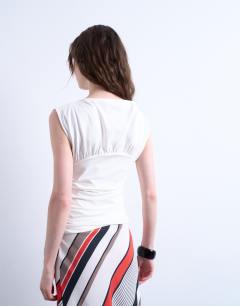 Model wearing Ruched detail sleeveless top in ivory