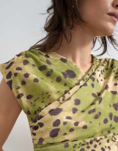 Model wearing Ruched detail wrap front short sleeve top in deer print