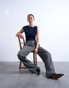 Model wearing Ruched drape tank in navy