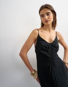 Model wearing Ruched front cami maxi dress in black