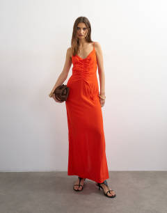 Model wearing Ruched front cami maxi dress in red