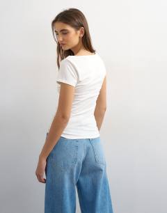 Model wearing Ruched front detail tee in ivory