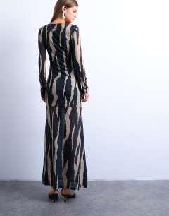 Model wearing Ruched front drop waist maxi dress in large animal print