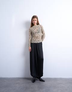 Model wearing Ruched long sleeve top in animal print