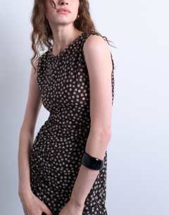 Model wearing Ruched polkadot maxi dress in brown