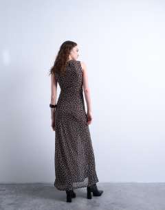 Model wearing Ruched polkadot maxi dress in brown
