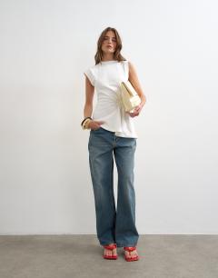 Model wearing Ruched side detail asymmetric top in ivory