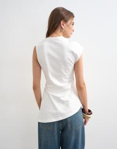 Model wearing Ruched side detail asymmetric top in ivory
