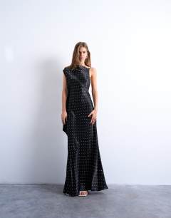 Model wearing Ruched side midi dress with drape back detail in black polka dot