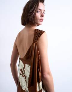 Model wearing Ruched side midi dress with drape back detail in brown and lime floral