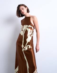 Model wearing Ruched side midi dress with drape back detail in brown and lime floral