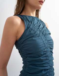 Model wearing Ruched sleeveless midi dress in navy