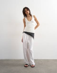 Model wearing Ruched v-neck tank top in ivory