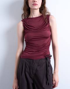 Model wearing Ruffle detail tank top in berry