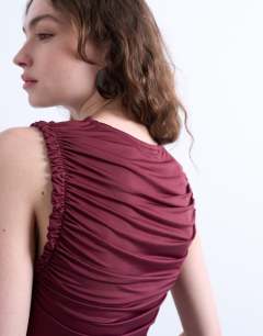 Model wearing Ruffle detail tank top in berry