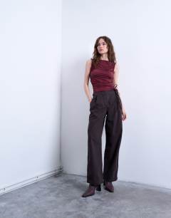 Model wearing Ruffle detail tank top in berry