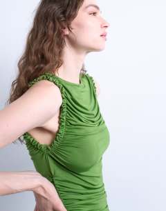 Model wearing Ruffle detail tank top in green
