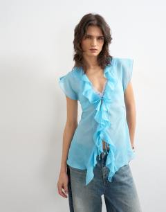 Model wearing Ruffle v neck top in blue