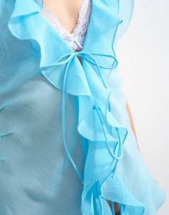 Model wearing Ruffle v neck top in blue
