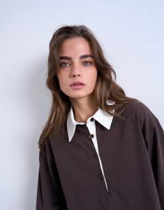 Model wearing Rugby long sleeve polo top in chocolate