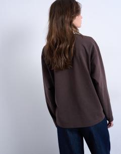 Model wearing Rugby long sleeve polo top in chocolate