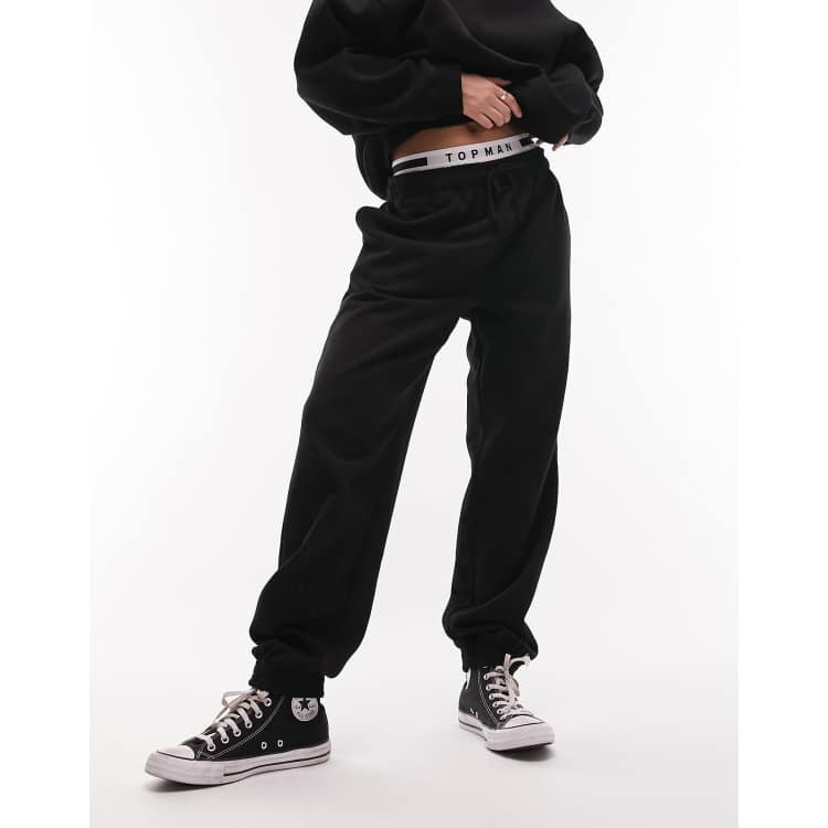 Topshop Ruimvallende oversized joggingbroek met boorden in zwart