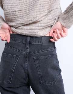 Model wearing Runway mid rise straight cropped jean in washed black