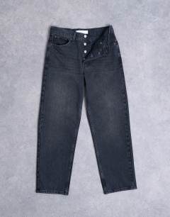 Model wearing Runway mid rise straight cropped jean in washed black