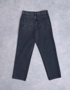 Model wearing Runway mid rise straight cropped jean in washed black