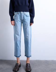 Model wearing Runway mid rise straight cropped jean with let down hem detail in bleach