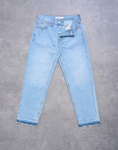 Model wearing Runway mid rise straight cropped jean with let down hem detail in bleach