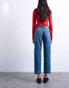 Model wearing Runway mid rise straight cropped jean with let down hem detail in vintage blue