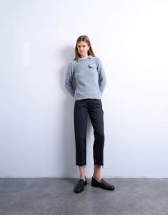 Runway mid rise straight cropped jean with let down hem detail in washed black