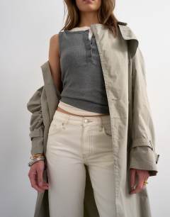Model wearing Runway mid rise straight jean in bone