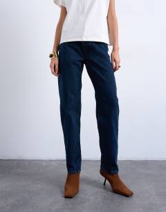 Model wearing Runway mid rise straight jean in navy