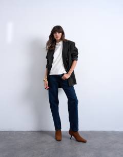 Model wearing Runway mid rise straight jean in navy