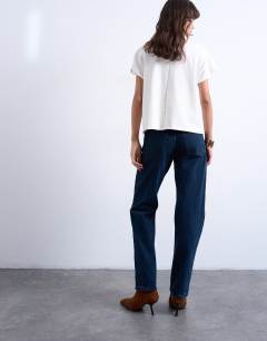 Model wearing Runway mid rise straight jean in navy