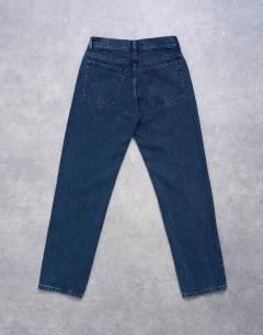 Model wearing Runway mid rise straight jean in navy