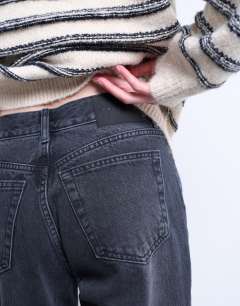 Model wearing Runway mid rise straight jean in washed black
