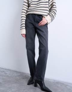Model wearing Runway mid rise straight jean in washed black