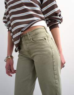 Model wearing Runway mid rise straight jean in washed khaki