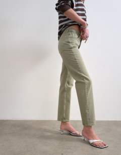Model wearing Runway mid rise straight jean in washed khaki